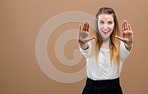 Young woman making a rejection pose