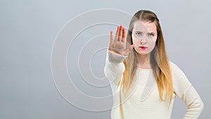 Young woman making a rejection pose