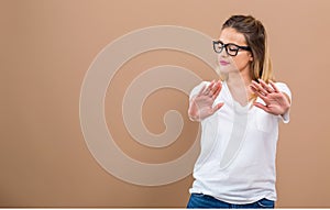 Young woman making a rejection pose