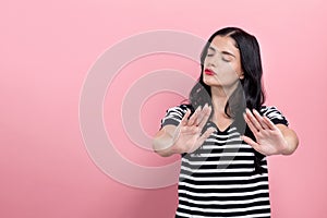 Young woman making a rejection pose