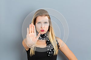 Young woman making a rejection pose