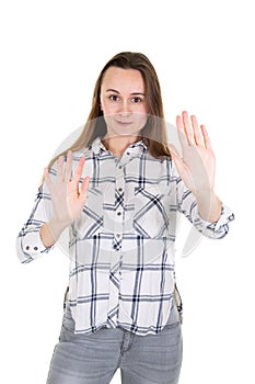 Young woman making a rejection pose hand sign stop refusal with both palm