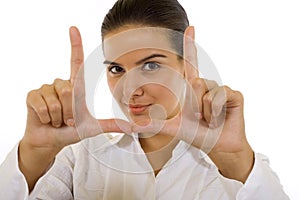 Young woman making a snapshot sign