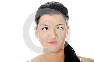 Young woman making squint photo