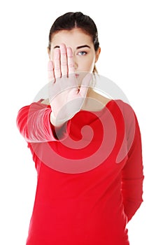 Young woman making stop sign