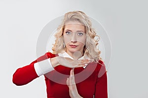 Young woman making time-out gesture