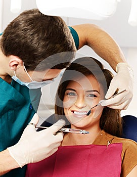 Young woman and male dentist