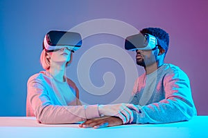 Young woman and man are afraid of dangerous VR environmnet