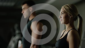 Young woman and man doing a fitness workout with dumbbells