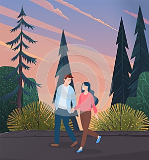 Young woman and man in love, holding each other s hand, walking outdoor along the forest road