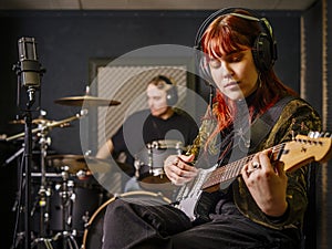 Young woman and man in a recording studio