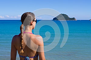 Young woman and Marathonisi island - Zakynthos, Greece