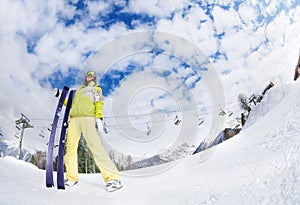 Young woman in mask holding ski fisheye view