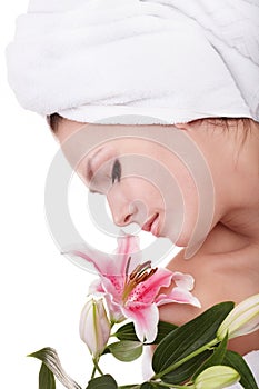 Young woman on massage table in beauty spa.