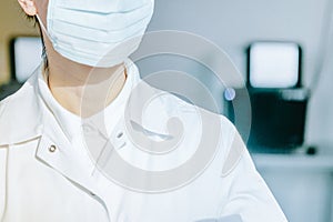 Young woman in medical face protection mask and gloves indoors on laboratory background