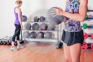 Young woman with medicine ball