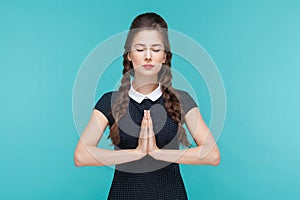 Young woman meditating and doing yoga or pray.