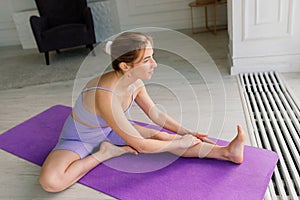 Young woman meditating at home, back, front and side view
