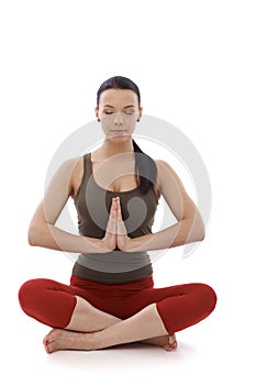 Young woman meditating in prayer position