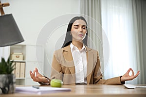 Young woman meditating. Stress relief exercise