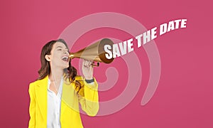 Young woman with megaphone and phrase SAVE THE DATE on background