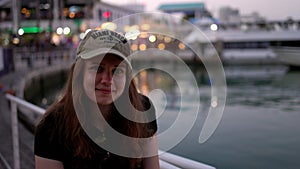 Young woman at Miami Bayside - close up shot in the evening