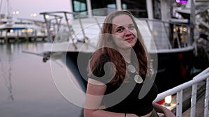 Young woman at Miami Bayside - close up shot in the evening