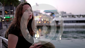 Young woman at Miami Bayside - close up shot in the evening