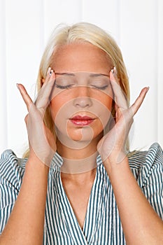 Young woman with migraine headache photo