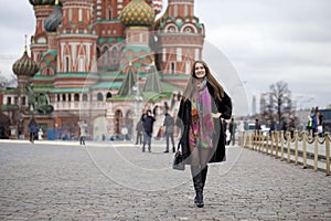 Young woman in a mink coat on the Red Square in Moscow