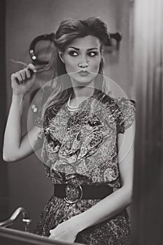 Young woman in mirrorr