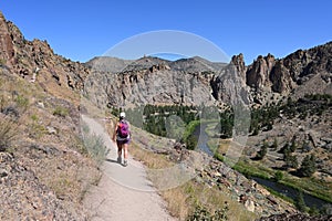 Young woman on Misery Ridge Trail in Smith Rock State Park, Oregon.