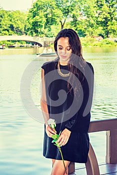 Young Woman missing you by lake