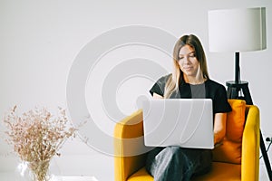Young woman mobile developer working on a laptop computer, programmer work