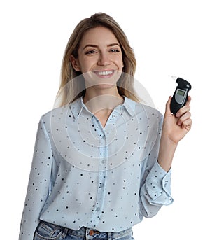 Young woman with modern breathalyzer on white