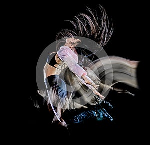 Young woman modern dancer dancing isolated black background light painting