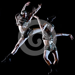 Young woman modern dancer dancing isolated black background light painting