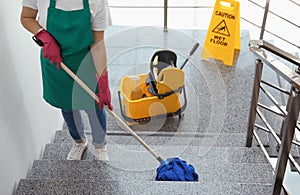 Young woman with mop