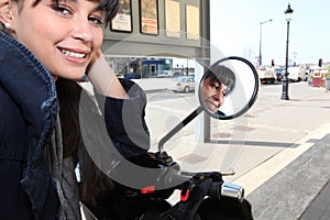 Young woman on a moped
