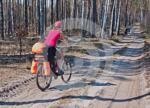 Young woman mountain bike ride on forest trail.