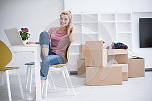Young woman moving in a new home