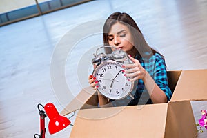 The young woman moving personal belongings