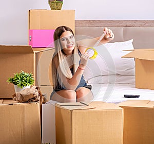 Young woman moving to new place