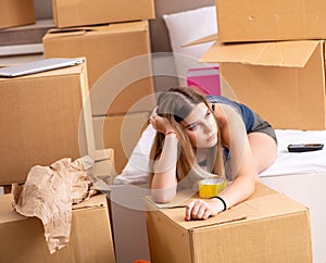 Young woman moving to new place