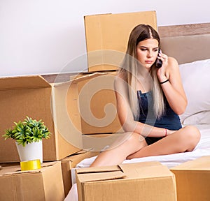 Young woman moving to new place