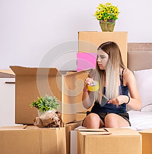 Young woman moving to new place