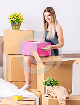 Young woman moving to new place