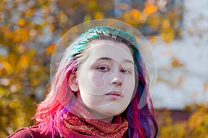 Young woman with multicoloured streaks hair