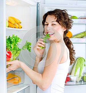 Young Woman near the Refrigerator