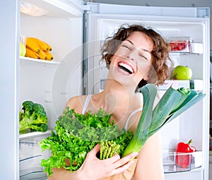 Young Woman near the Refrigerator